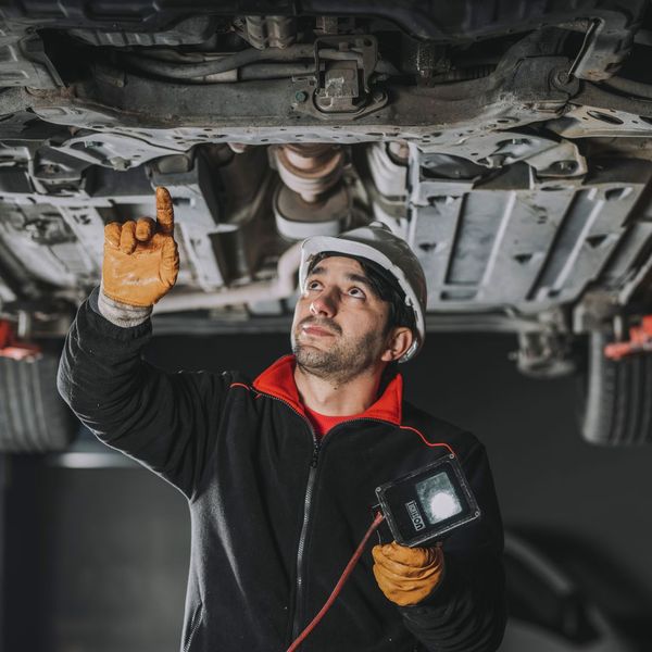 Auto technician working on auto repair