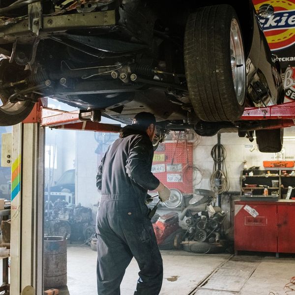 mechanic under a car
