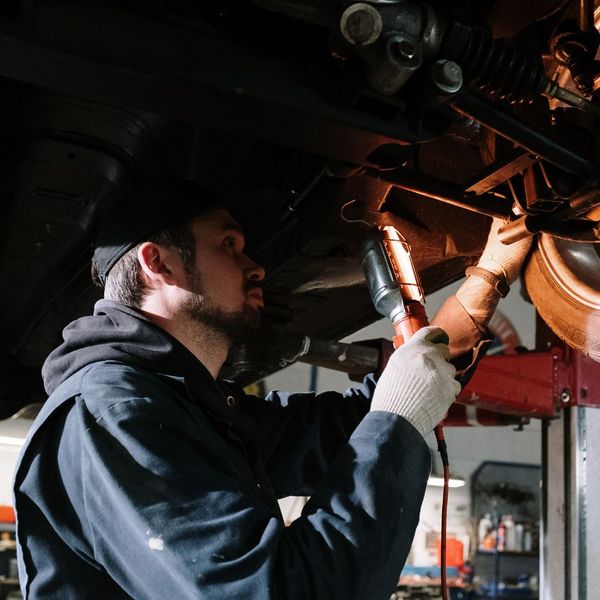 person working on car