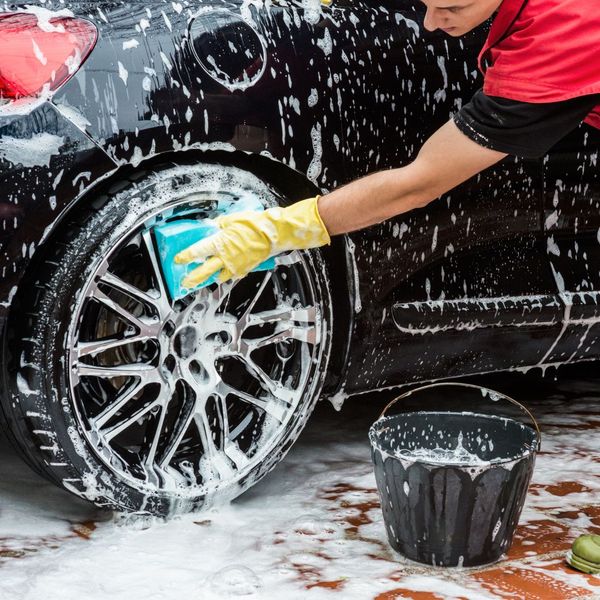 man washing his car