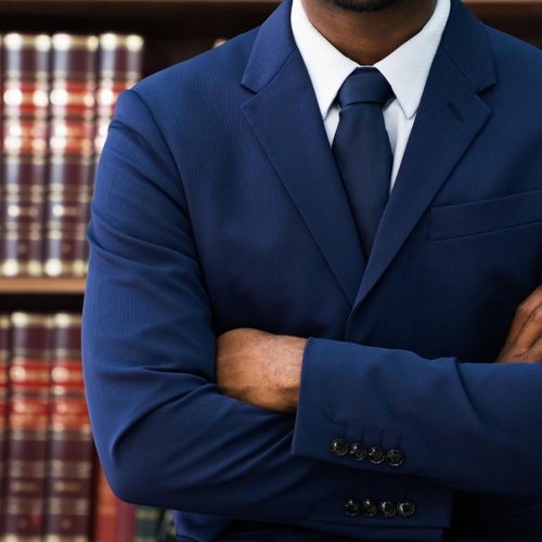 lawyer standing in front of books