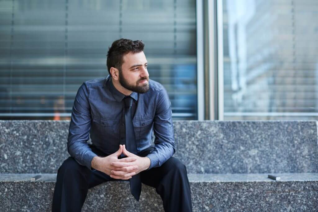 young-bearded-brazilian-man-leans-forward-confidently-on-a-bench-in-the-financial-district-in-new_t20_AlGeN6-1024x683.jpg