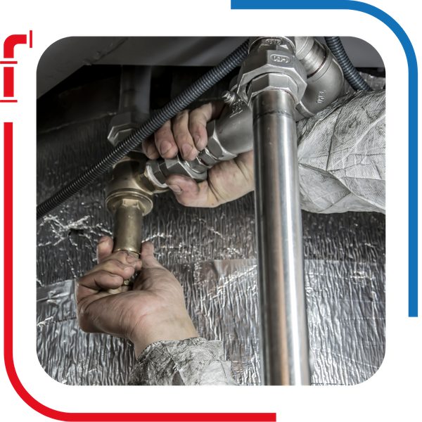 plumber working on pipes