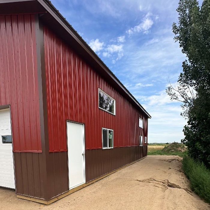 Side of red horse arena building