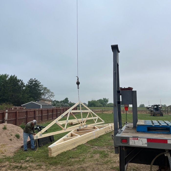lifting trusses to roof of pole barn