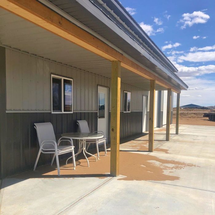 structure with roof over patio