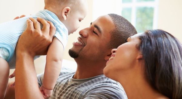 couple holding newborn baby