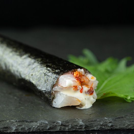 A closeup of a high end sushi roll