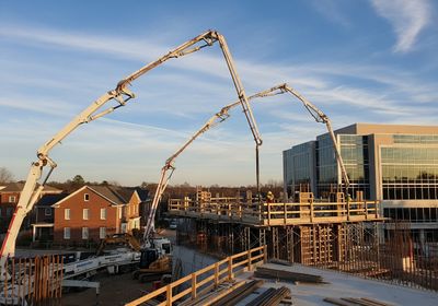 Construction Site with Concrete Pump Trucks
