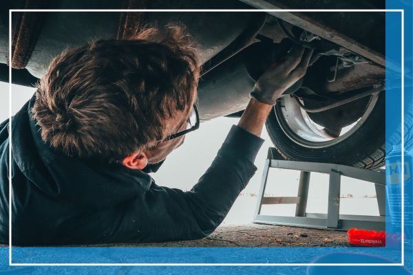 Mechanic working underneath a car