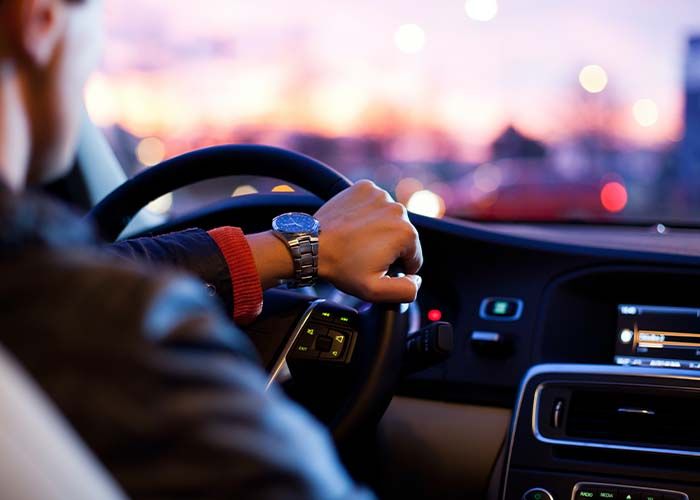  image of man with hand on the steering wheel. 