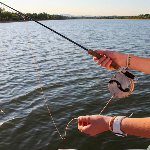 antique fishing rod in use