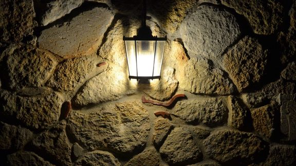 lamp on stone wall