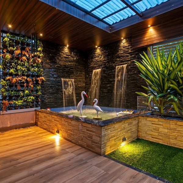 outdoor spa with wall lighting