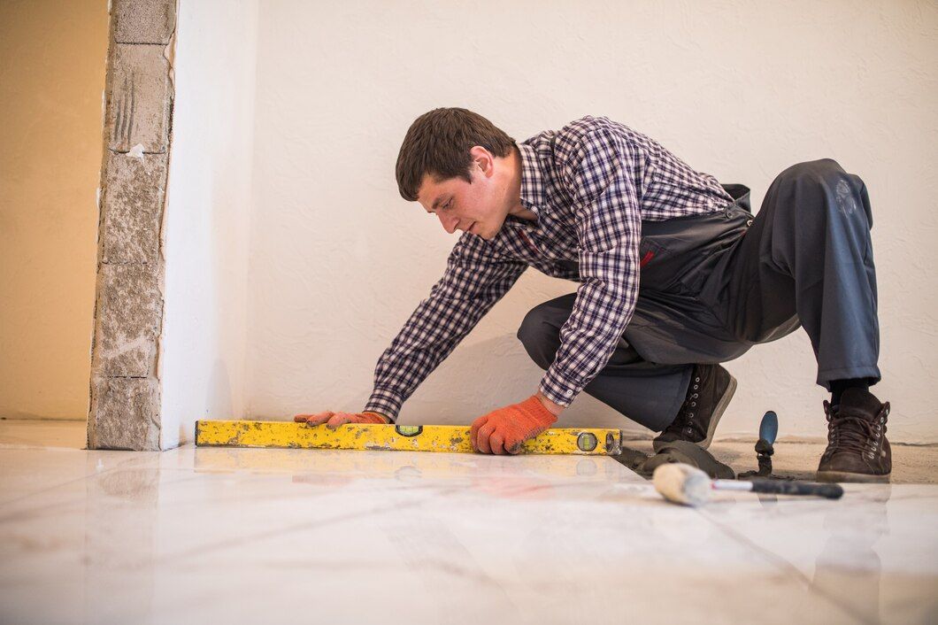 home-tile-improvement-handyman-with-level-laying-down-tile-floor_231208-6794.jpeg