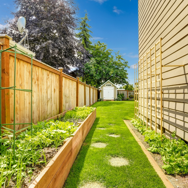 image of a fence next to a garden