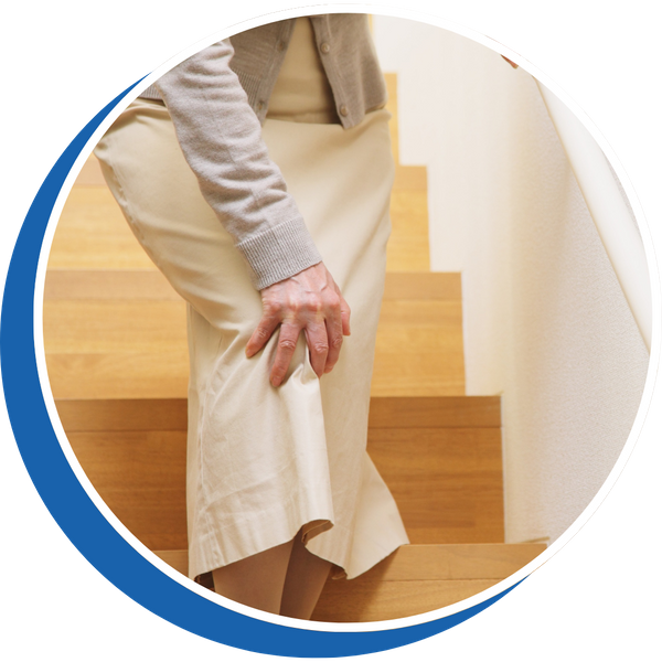 older woman bent over on stairs holding her knee older woman bent over on stairs holding her knee