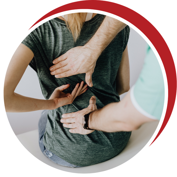 woman wits on exam table with doctor placing hands to source back pain