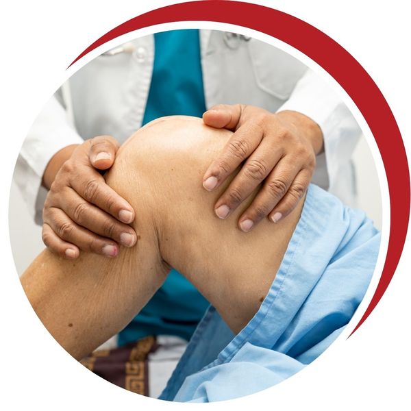 Doctor feeling a patients knee