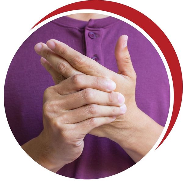Close-up of a person gripping their hands together, indicating joint or nerve pain in the hands or fingers.
