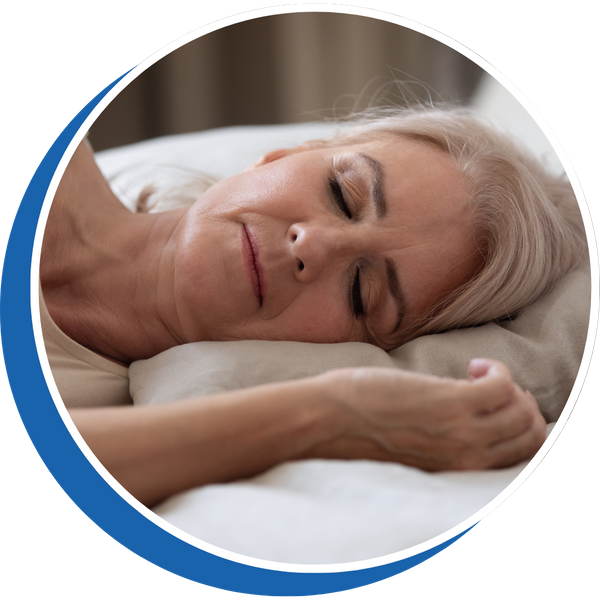 older woman lying down with head resting on pillow