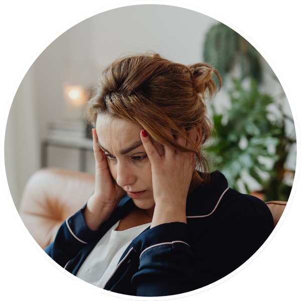 A woman with a headache.