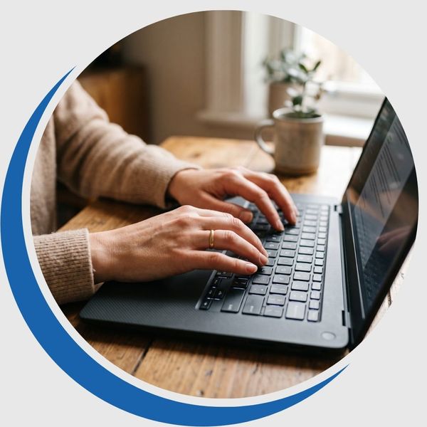 Close-up of a woman typing smoothly on a laptop keyboard with full wrist and hand mobility.
