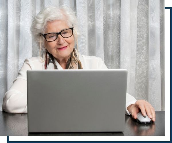 an older woman using her computer