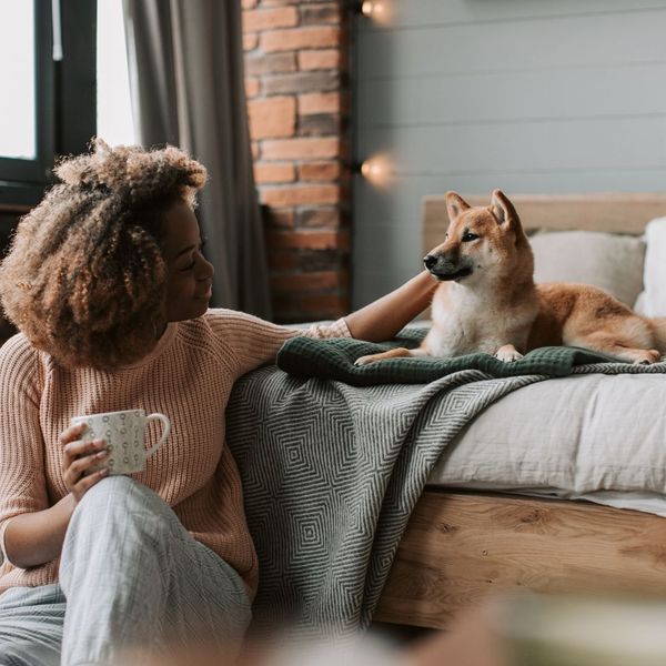 woman petting her dog
