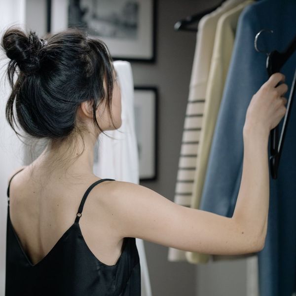 woman looking through her closet