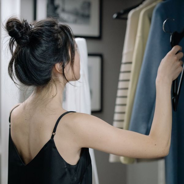 woman looking through her clothing