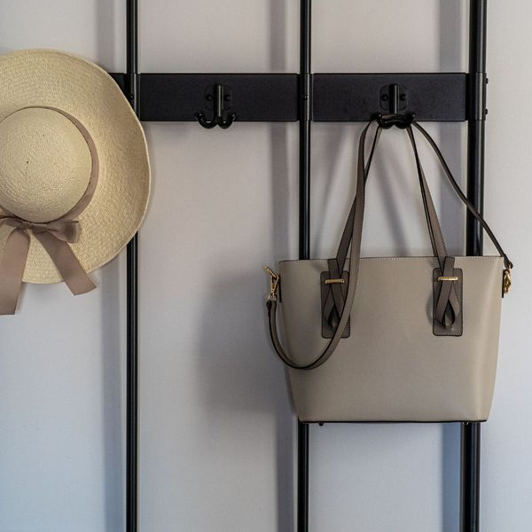 purse and hat hanging on hooks