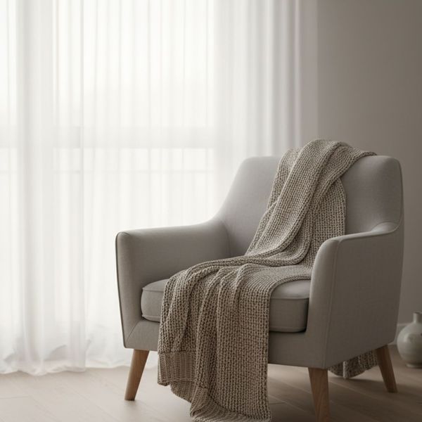 Sheer white curtain diffusing soft natural light into an apartment