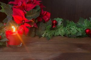 candle and poinsettia