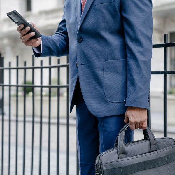 professional holding a briefcase professional holding a briefcase