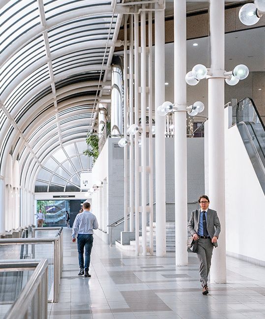 Two men walking in a building lobby