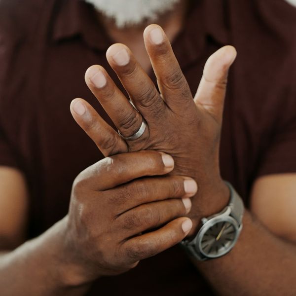 closeup of man massaging the pain in his hand 
