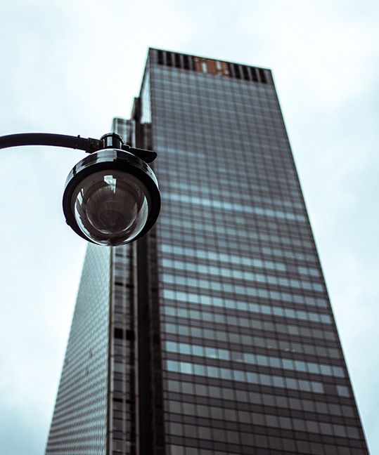 A security camera outside a tall building 