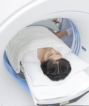 A woman getting a CT scan
