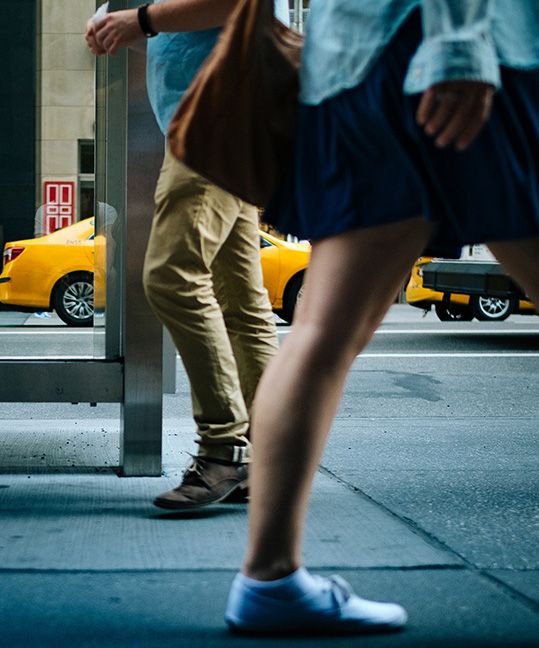 Pedestrians walking by a street