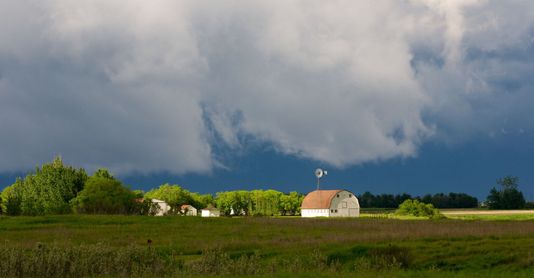 barn with stormy clouds 