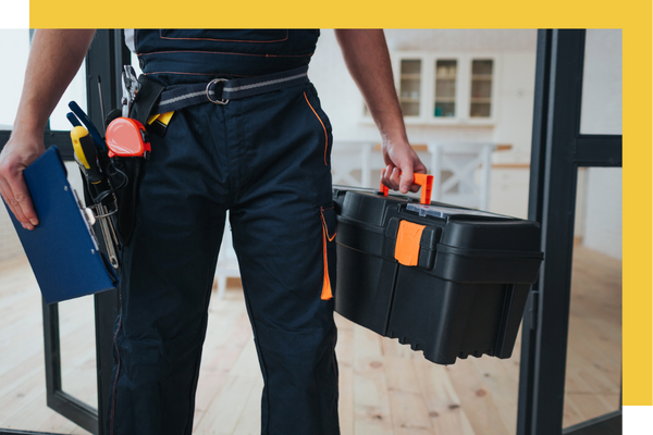 handyman with toolbelt and toolbox