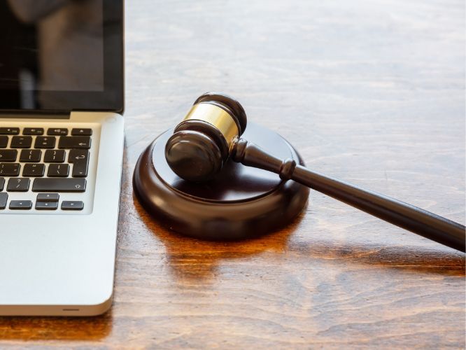 a gavel and a laptop