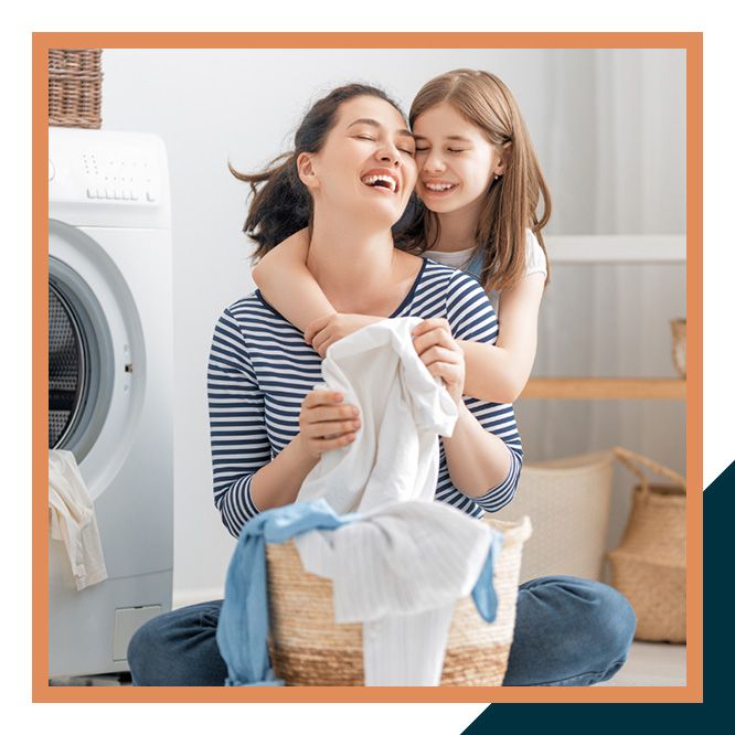 Mother and daughter doing laundry