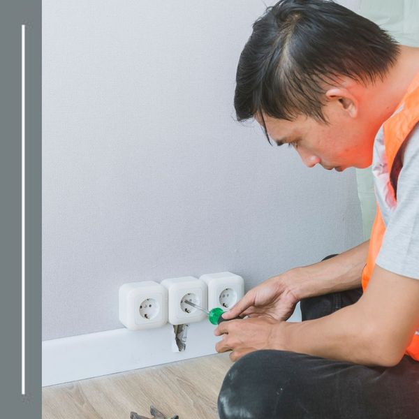 electrician working on an outlet