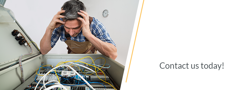 Man Looking At Fuse Box