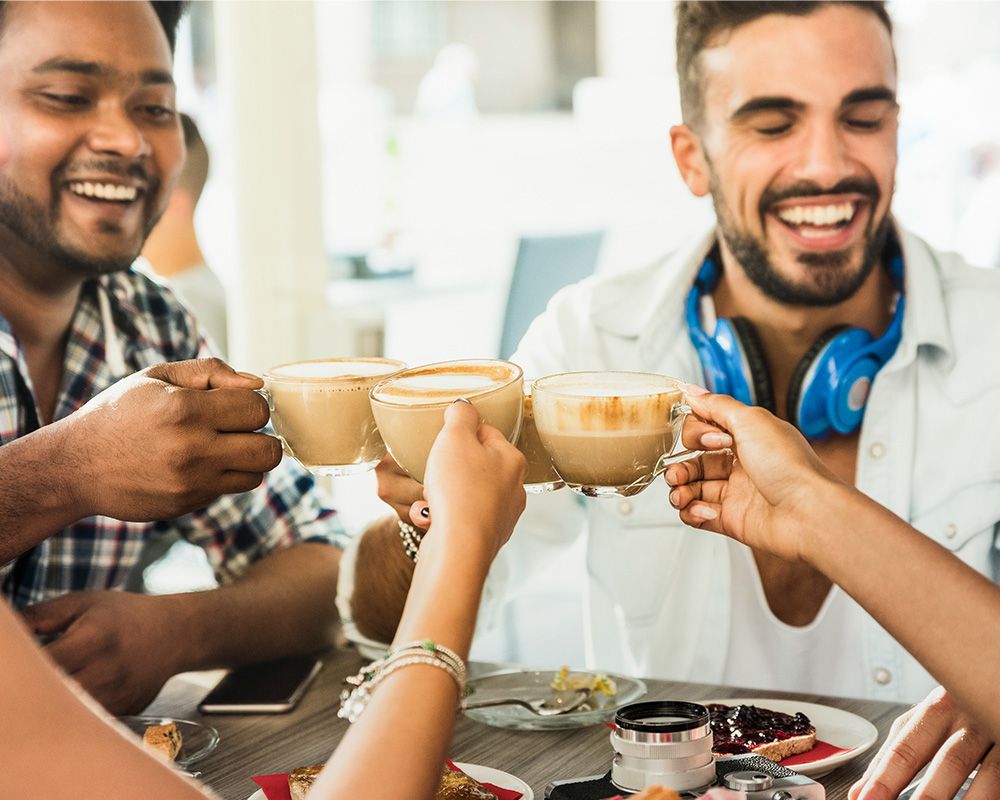 friends smiling over coffee