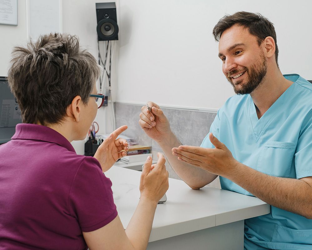 patient talking to audiologist