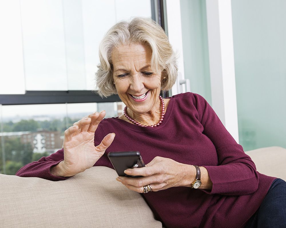 woman looking at smart phone