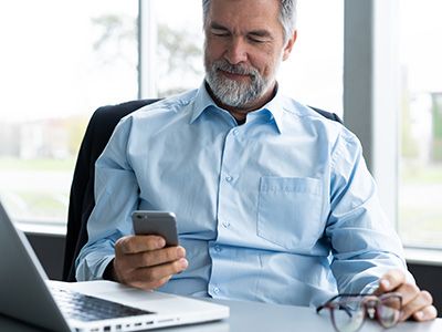 man looking at smart phone